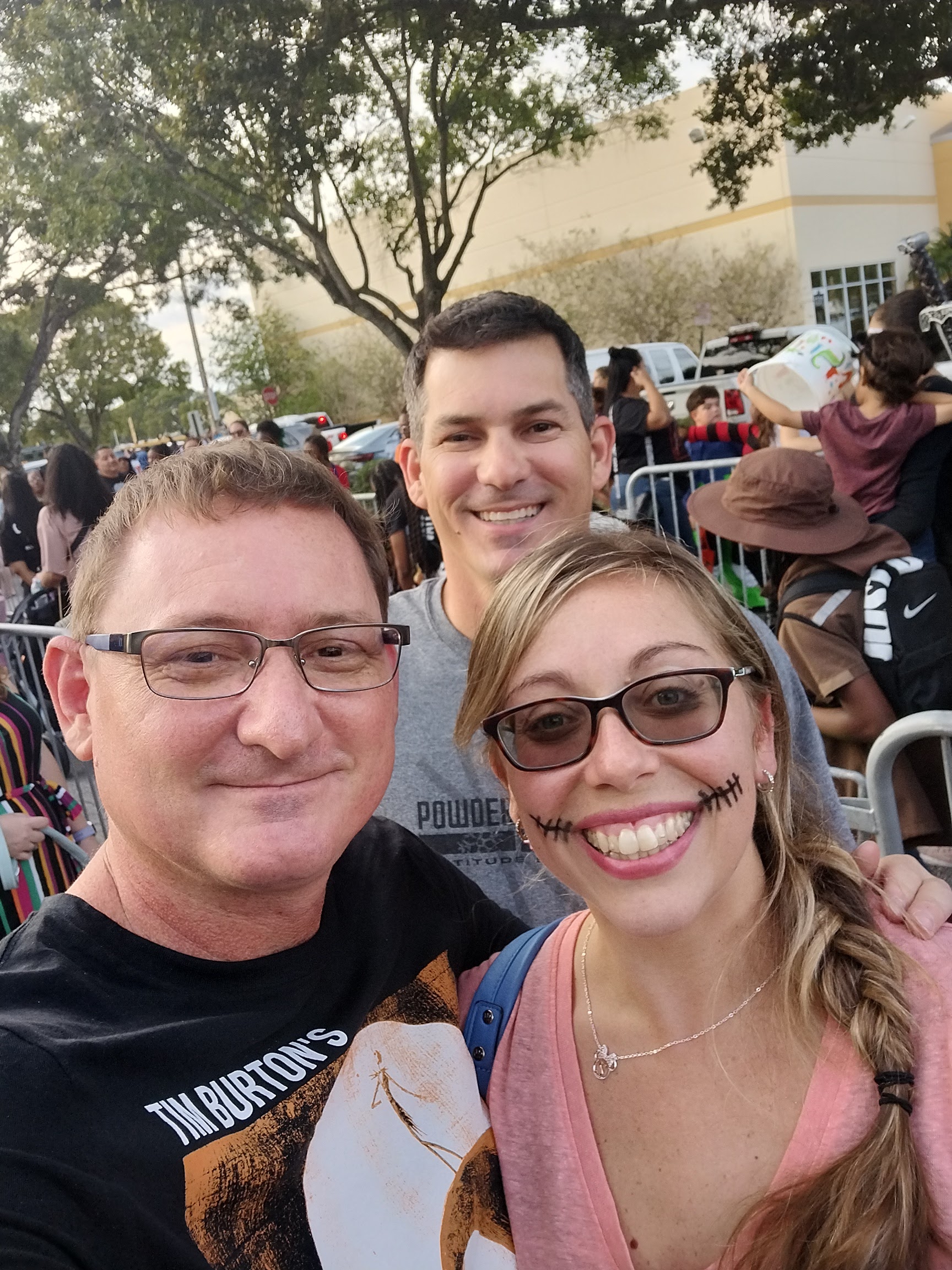 Justin and Shaina smiling together at an outdoor event