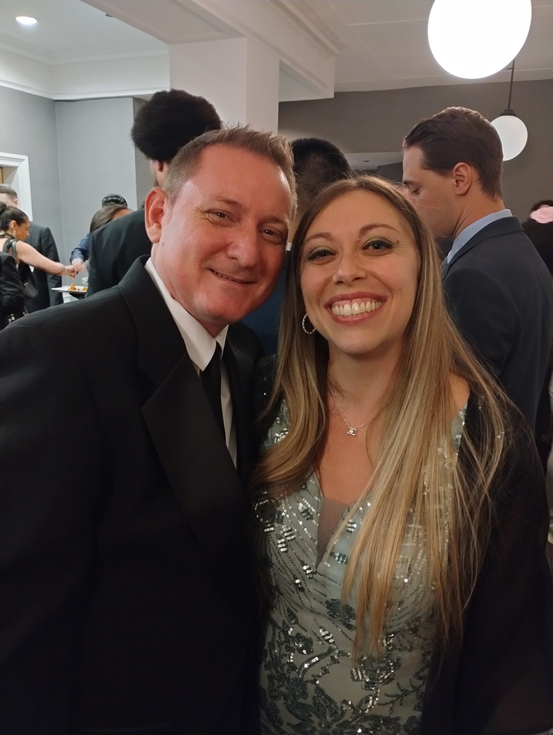 Justin and Shaina dressed up together at a formal event
